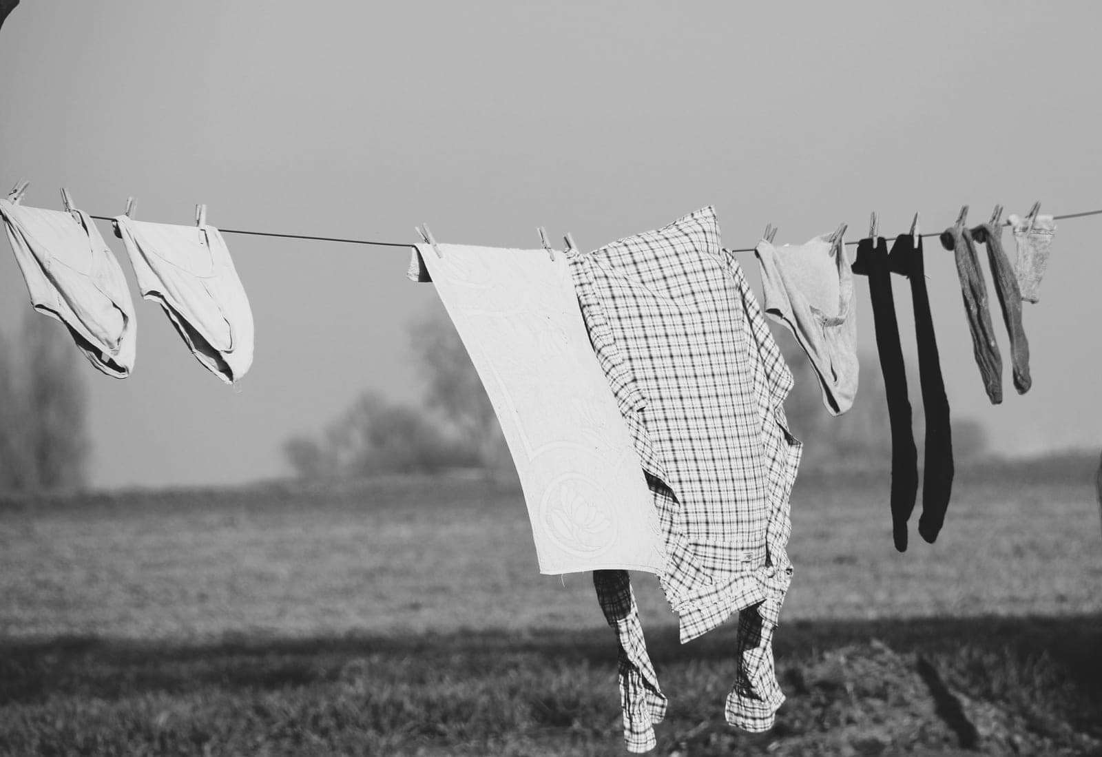 Socks and small items hanging on clips to dry