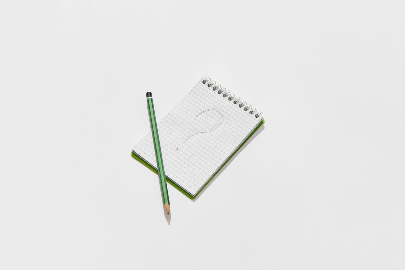 Handwritten question marks on paper notes