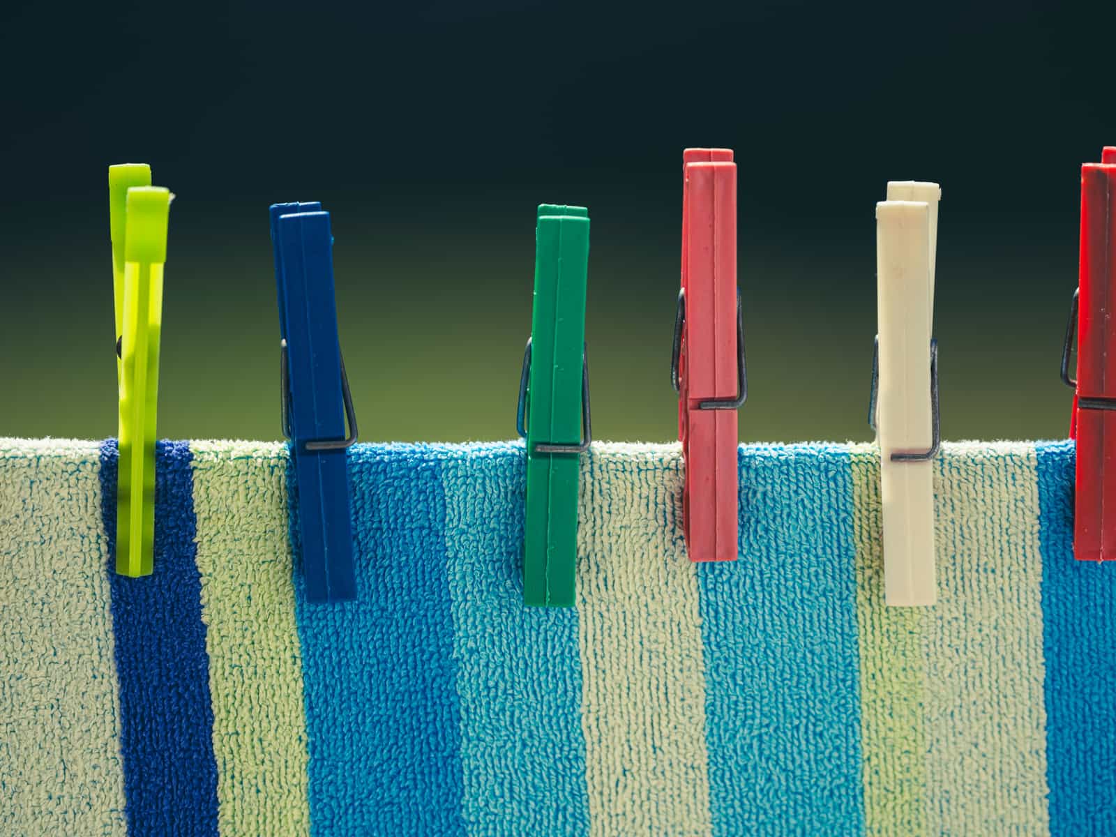 A washing line with pegs strung indoors
