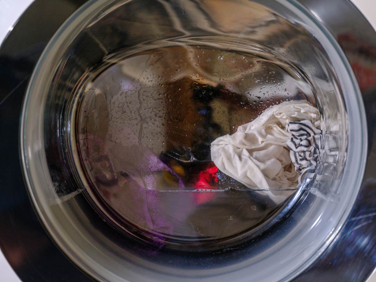 A washing machine drum part-way through a wash cycle