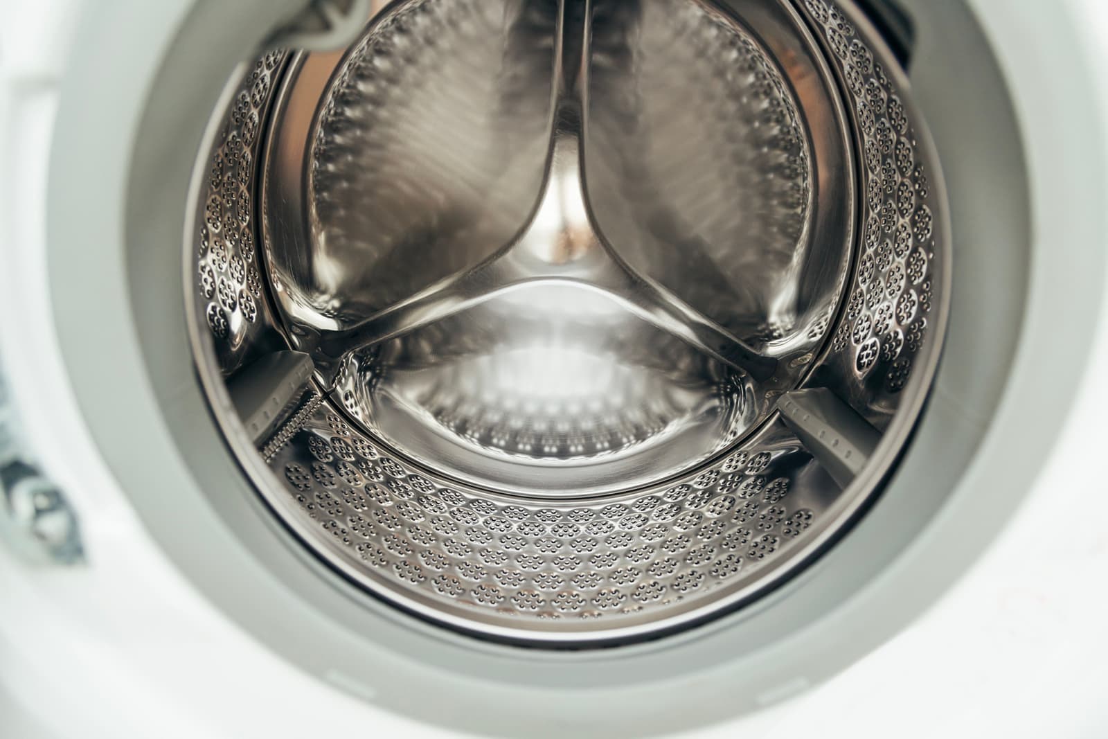 A washing machine drum with laundry inside