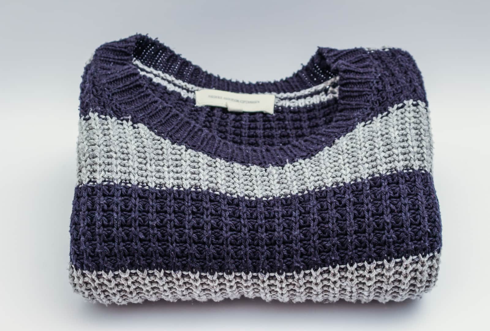 Folded wool knitwear laid flat