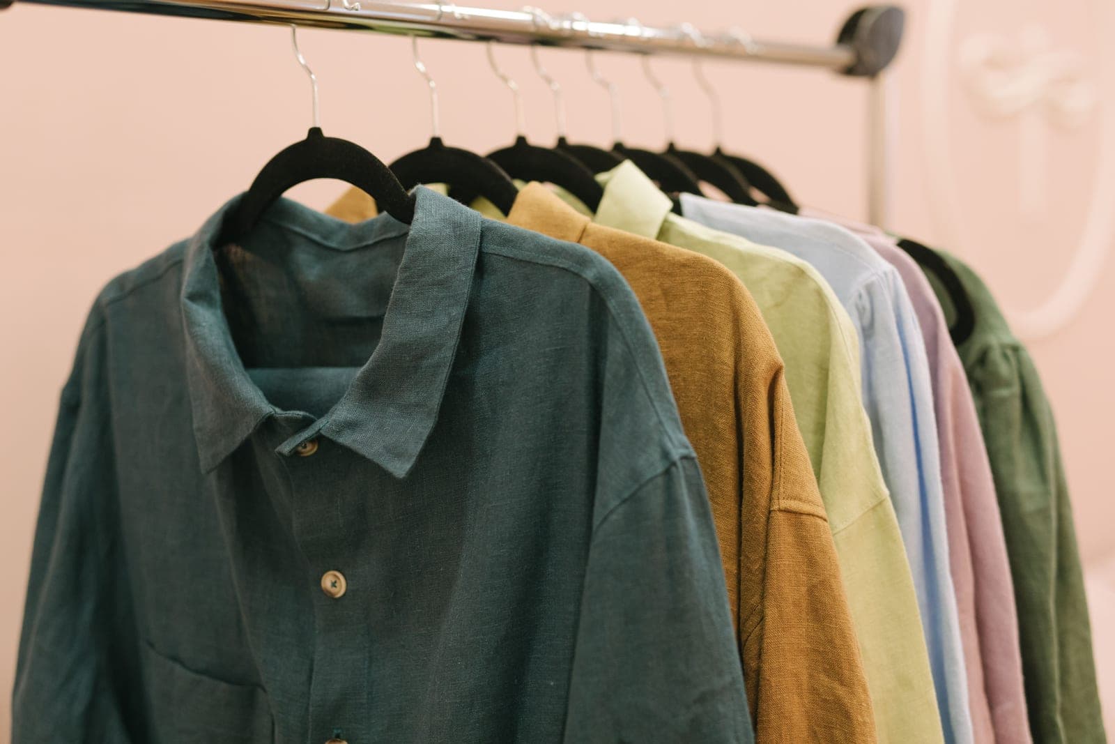 A creased linen shirt hanging on a hanger